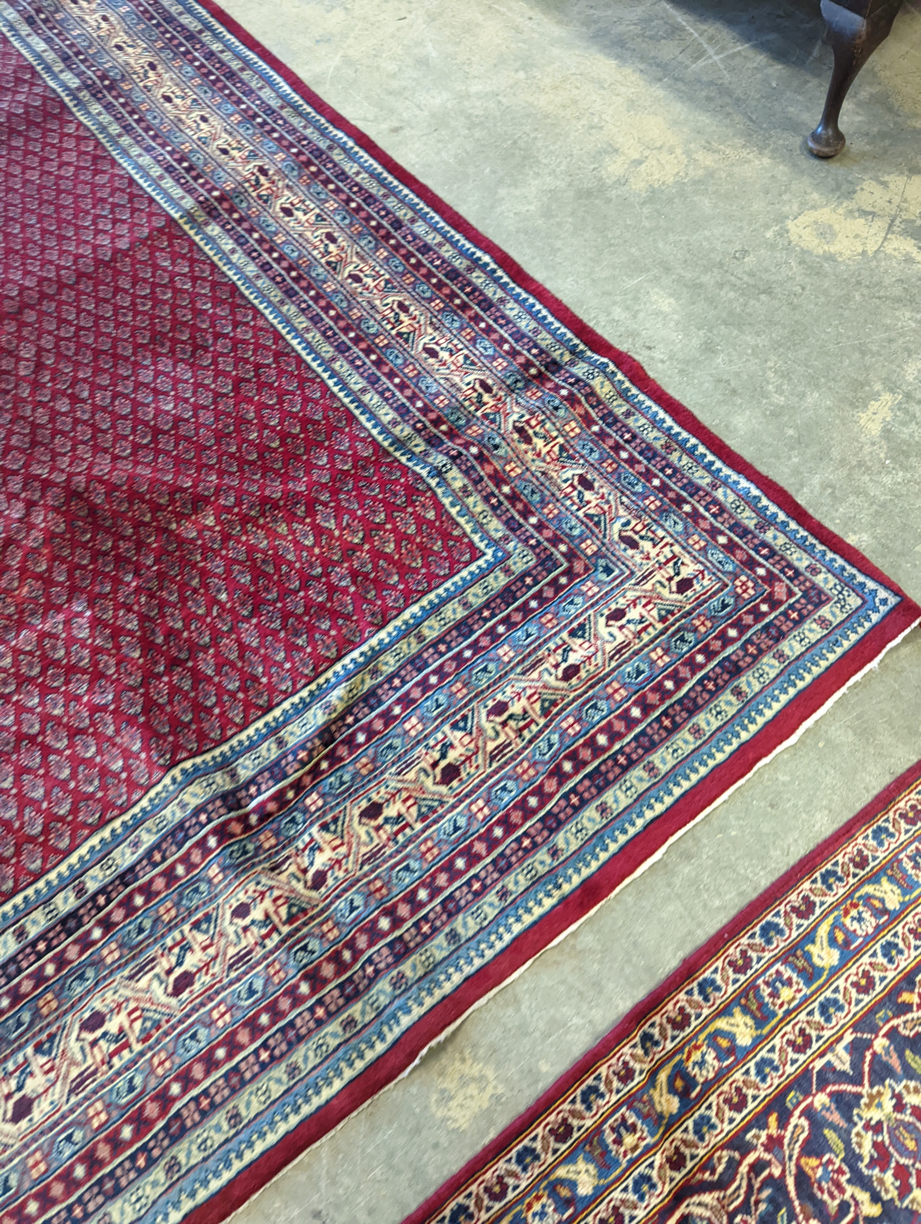 An Araak crimson ground carpet, 350 x 250cm